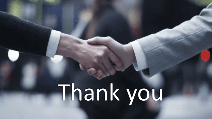 Business thank you slide with handshake image and clean white blue layout.