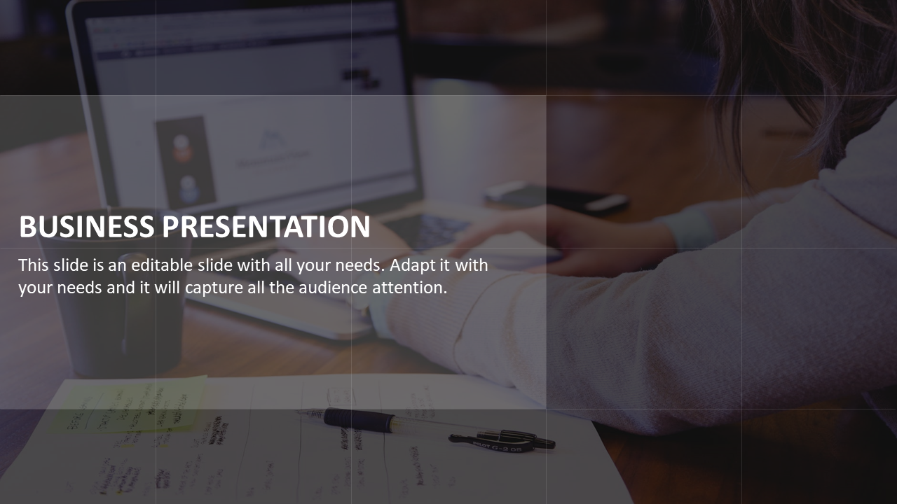 Business presentation slide with a focus on a person working on a laptop and notes on the table.