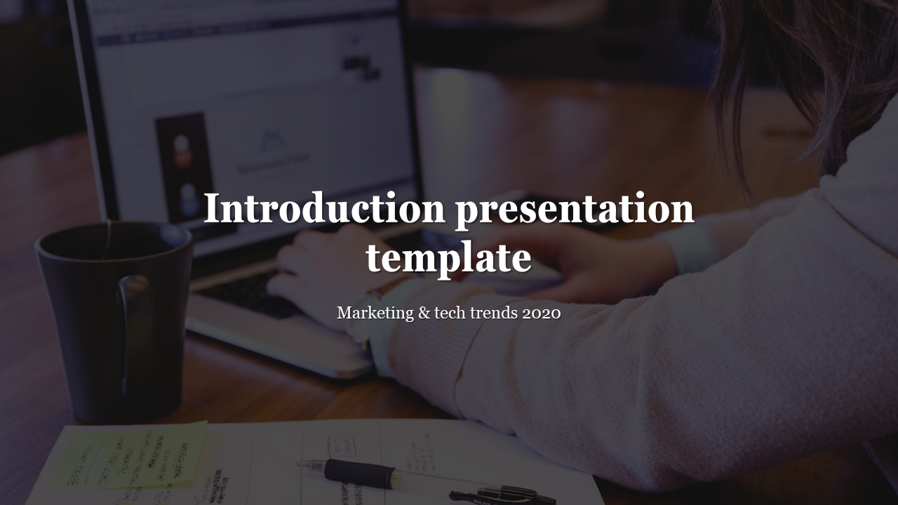Introduction presentation template featuring a person working on a laptop with marketing and tech trends 2020.