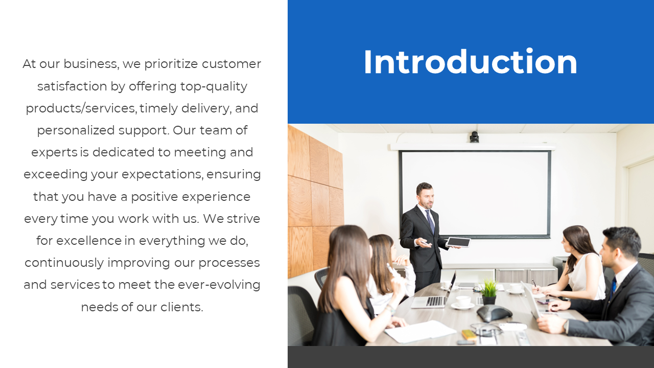 Formal meeting with a man presenting to a team of professionals, using laptops and a blue title box at the top.