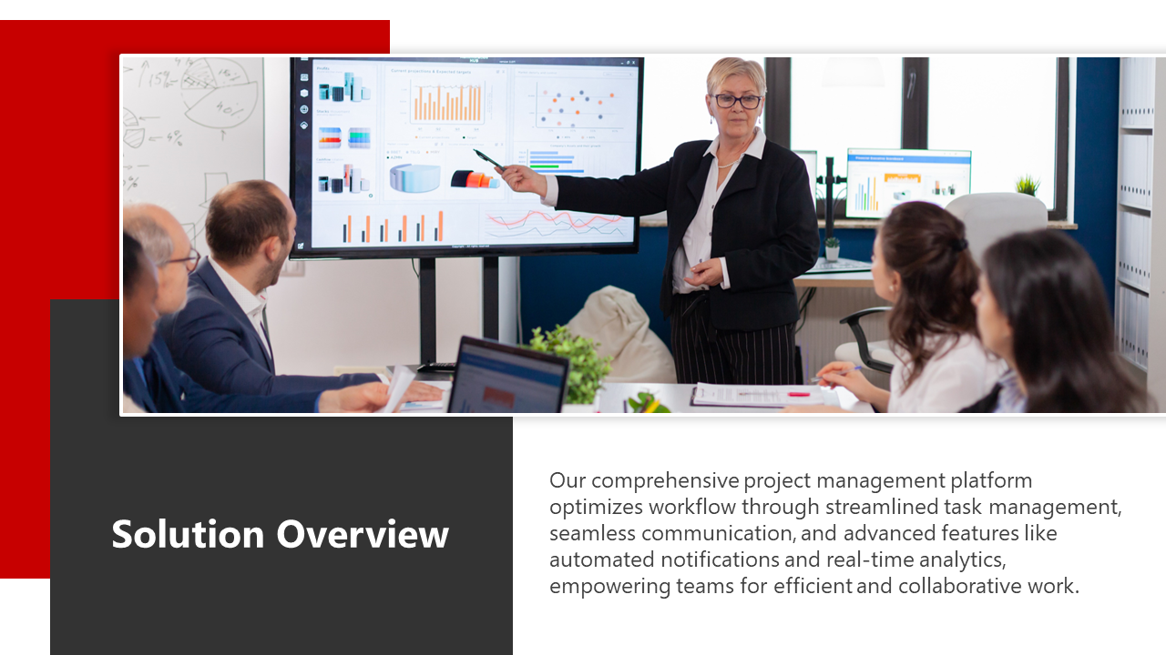 A professional woman in a suit presenting analytics on a large screen to a team, illustrating a business solution overview.