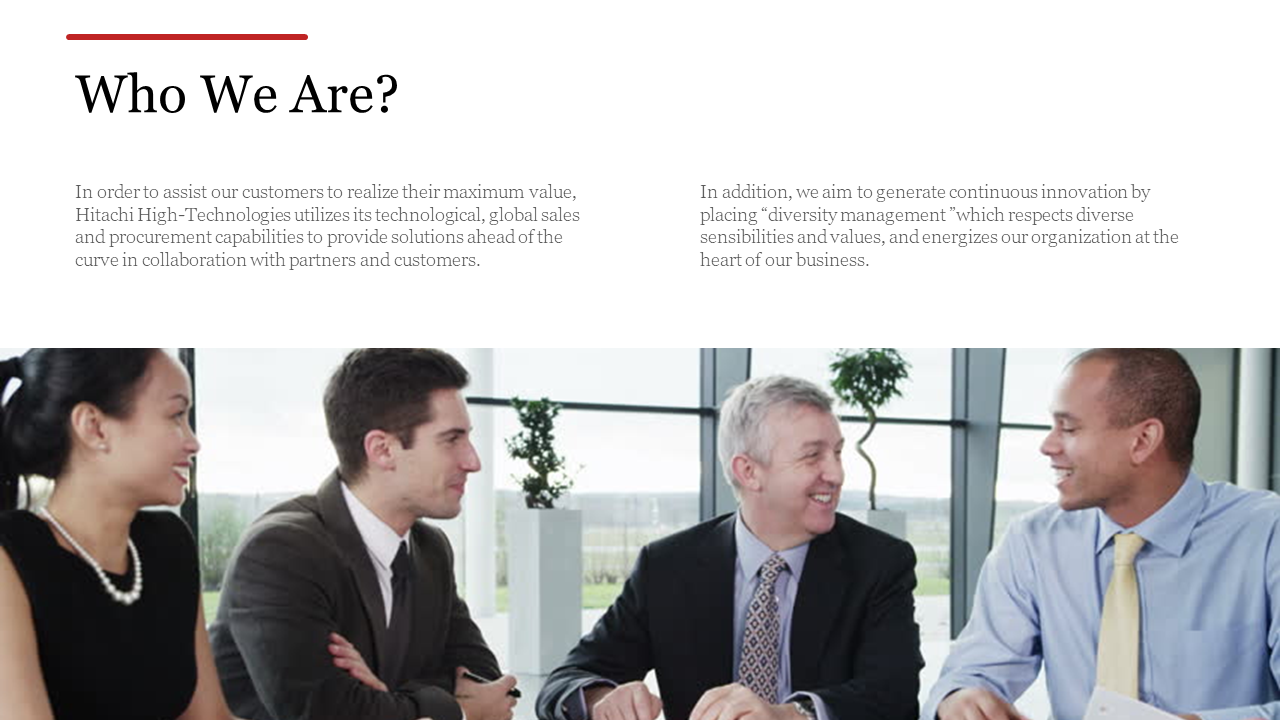 Slide with two text columns on a white background and a wide image of professionals in a business meeting below.