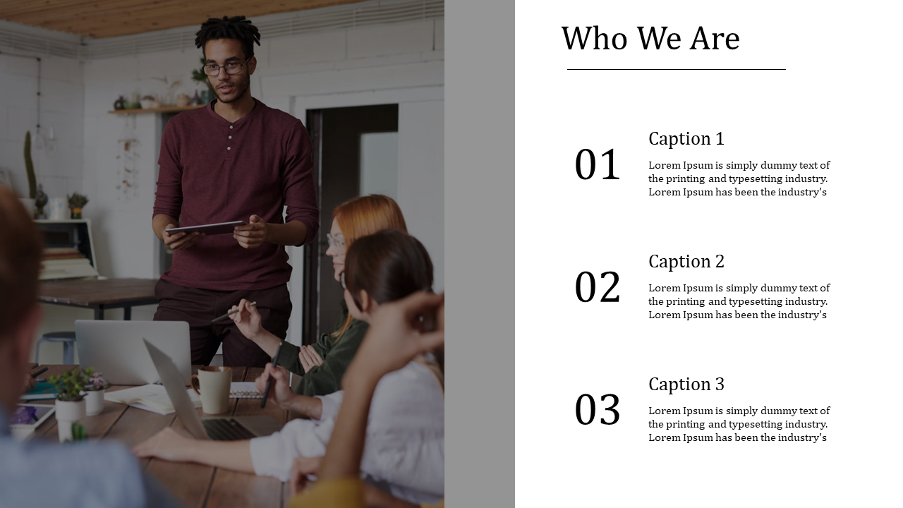 A team discussion in a meeting room with a presenter showing a tablet to the team with captions on a white backdrop.