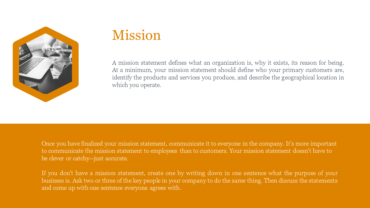 Mission PPT slide with an orange section and a black and white image of a person typing on a laptop.