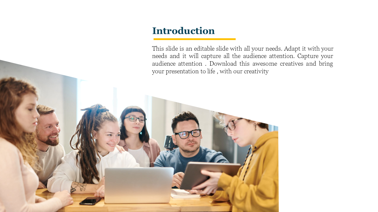 A group of six people working together around a table with laptops and notebooks, with an introduction slide in white theme.