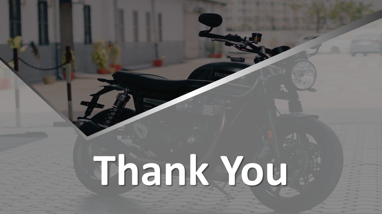 Modern thank you slide with bold text overlaying a black motorcycle image, partially covered with gray diagonal shapes.