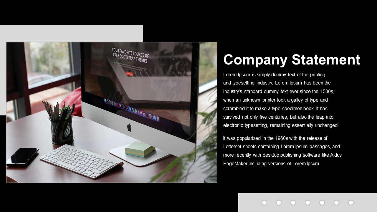 Slide with a desktop computer on a wooden desk, and bold white text on black, with subtle gray design accents.