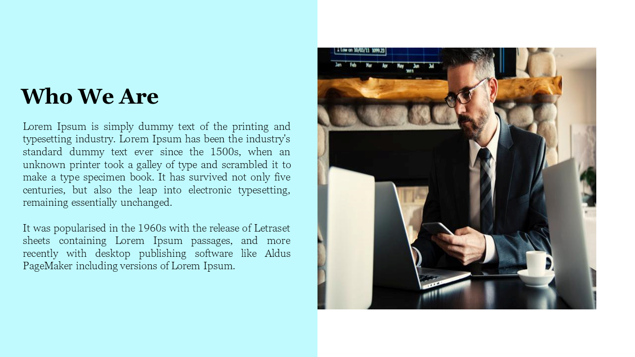 A professional man in a suit working on a laptop and holding a smartphone in front of a stone fireplace and a teal text box.
