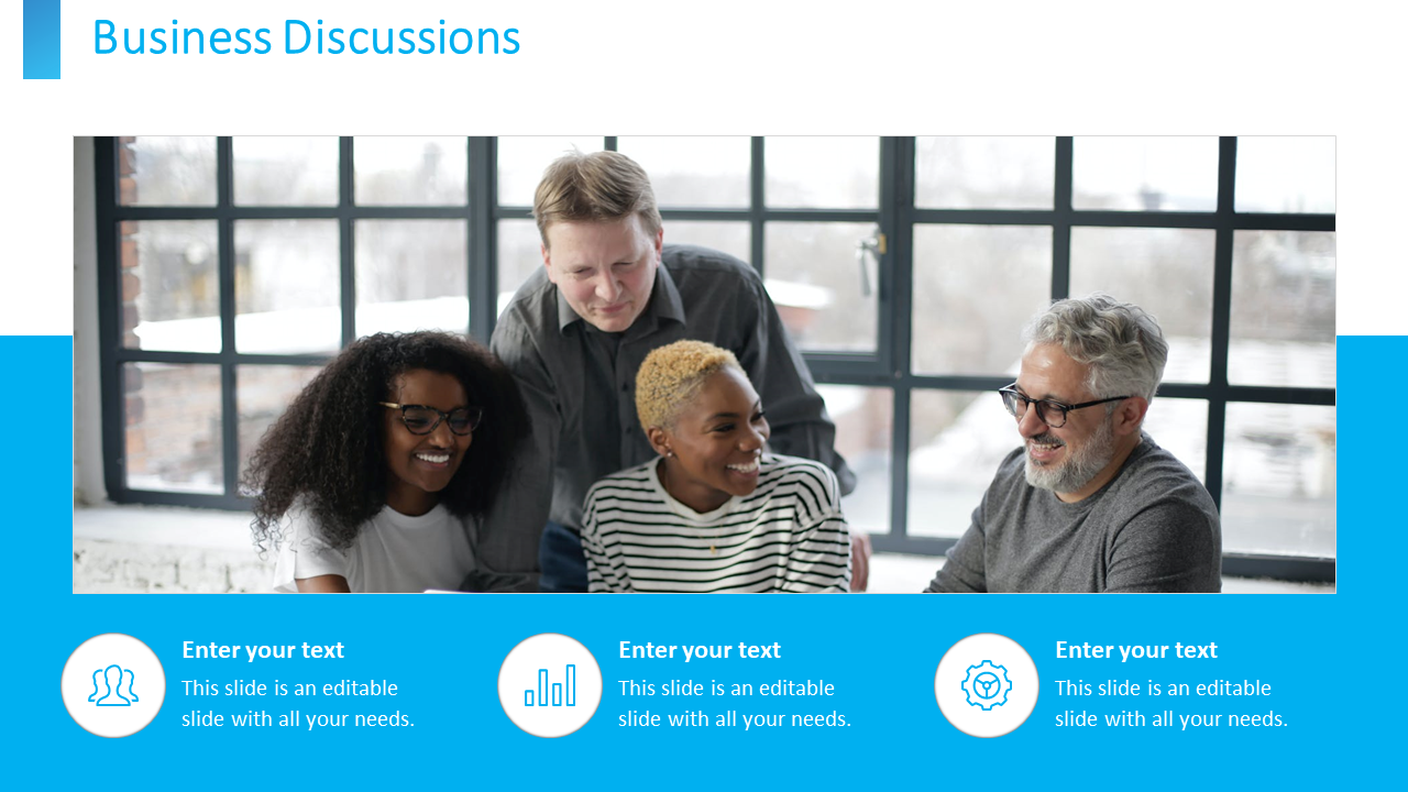 A diverse group of professionals having a business discussion near a window in a bright office with blue icons.