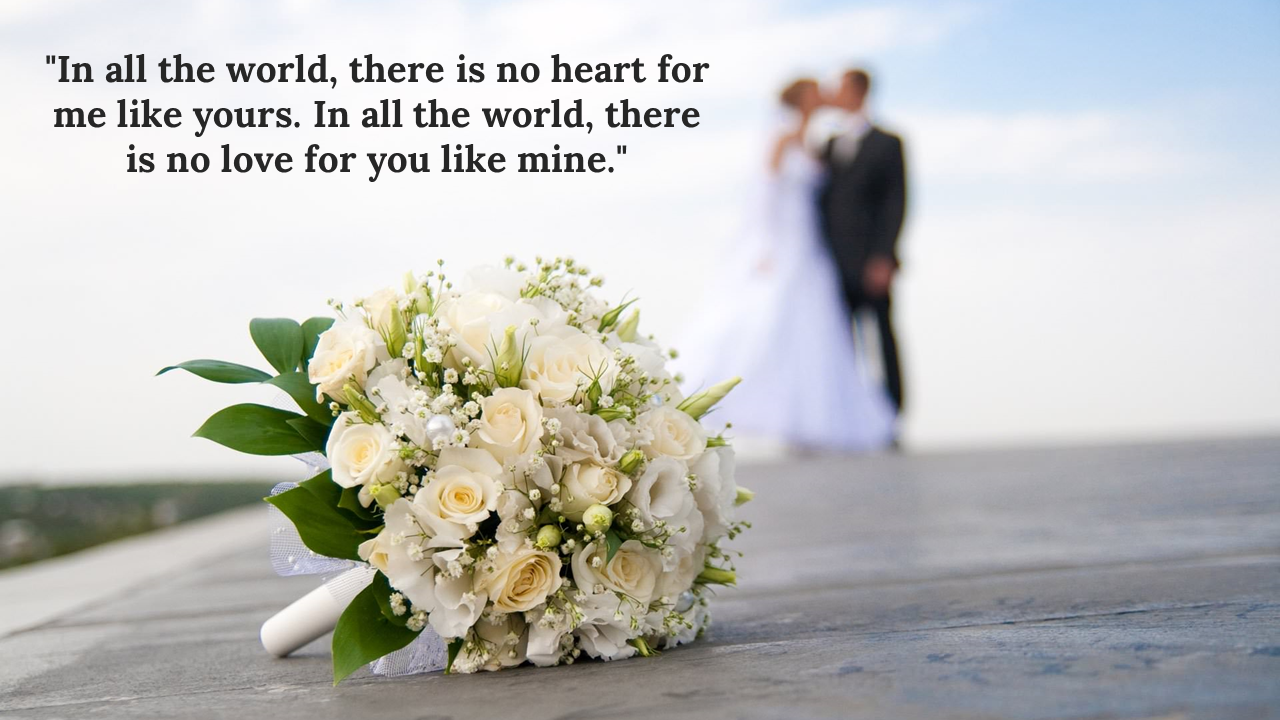 Wedding bouquet with white roses in the foreground, blurred couple in the background with a romantic quote.