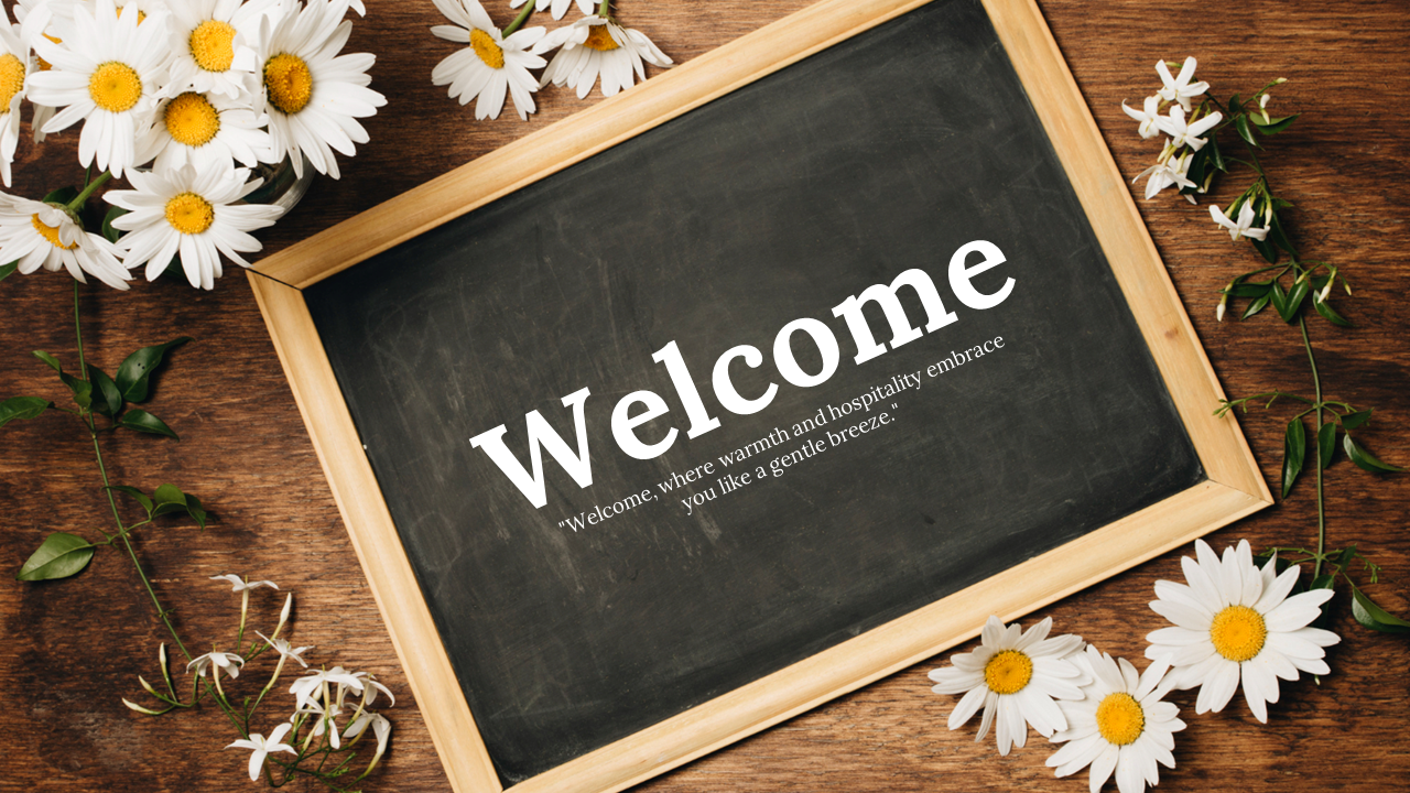 A welcome message on a chalkboard surrounded by daisies, with a quote about warmth and hospitality.