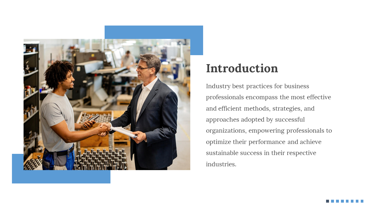 A worker in a shirt and pants shakes hands with a suited professional in an industrial setting, with blue accents.