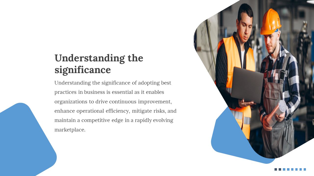 Two workers in safety vests and helmets discuss a laptop in a factory, with blue geometric shapes and text on the left.