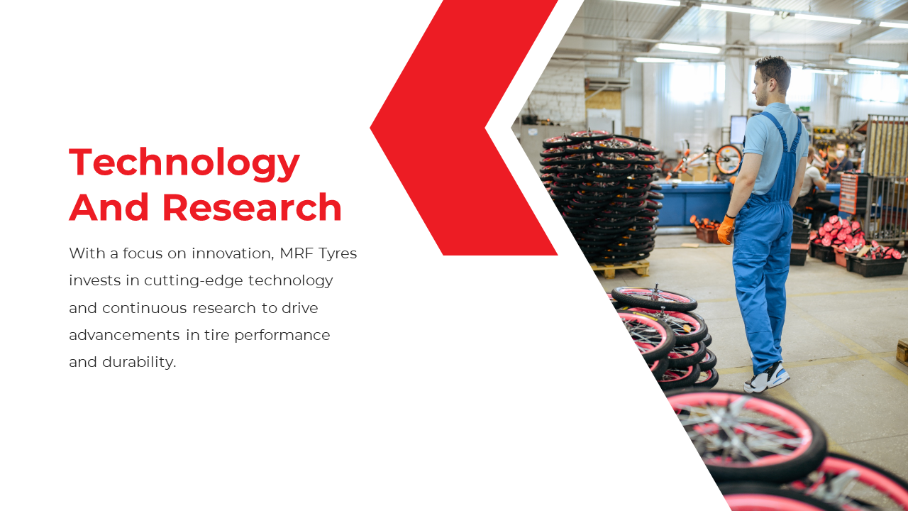 Slide shows a worker in blue overalls standing in a factory filled with tires, with a red arrow design to the left.