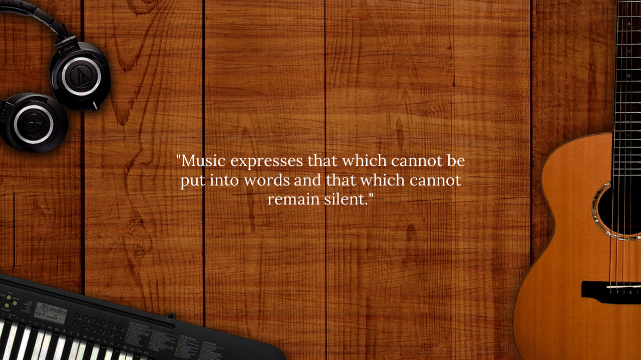 Flat lay of musical items on wooden planks with an inspirational music quote displayed at the center in white text.