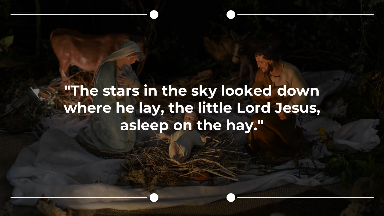 Christmas slide showing baby Jesus lying on hay between Mary and Joseph, with cow and donkey in a dimly lit stable.