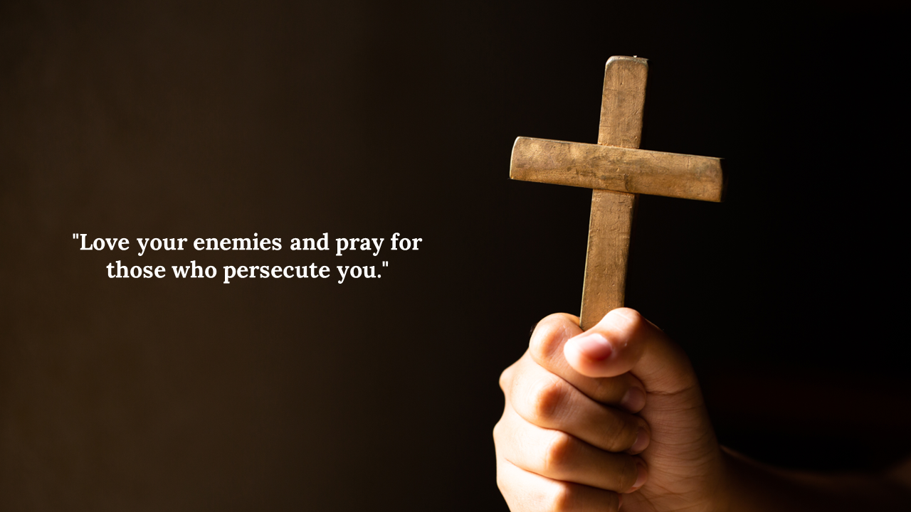 Hand holding a wooden cross against a dark background with a scripture quote in white text on the left.