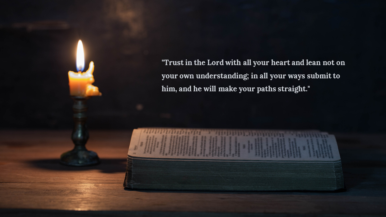 Flickering candle and open Bible on table with scripture quote about trusting in the Lord displayed on the right.