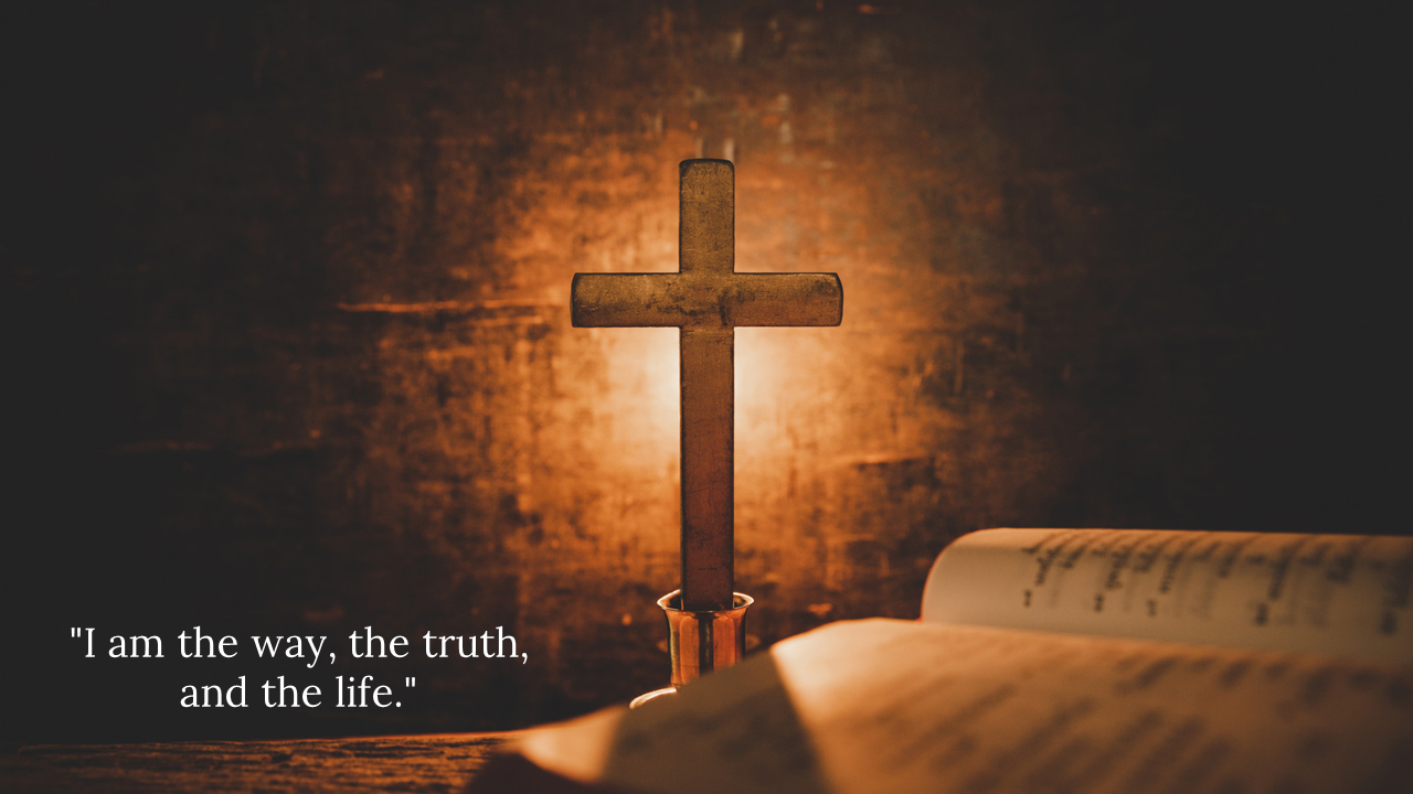 Wooden cross lit from behind on a rustic background, with an open Bible in the foreground and a Bible verse on the left.