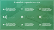 Agenda slide showing a blured image of a office table with a laptop showing nine numbered caption areas.