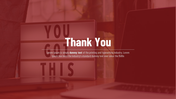 Slide featuring a thank you message over a red tinted image of a lightbox with words and a laptop.