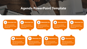 Agenda slide showing nine orange speech bubbles, each with a number and placeholder text, below the desk background.