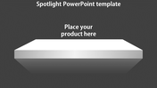 Slide featuring a spotlight effect with a reflective white surface and space to display a product, on a gray backdrop.