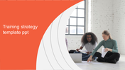 Training strategy slide with a bold orange design on the left and two people reviewing papers on the right.