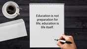 Desktop scene with a motivational education quote written on a notepad, a hand adding a dot, and a coffee cup nearby.