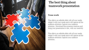 Close-up of three people holding large red and blue puzzle pieces, assembling them on a wooden table.