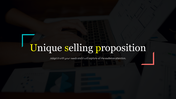 Unique selling proposition slide in bold white and yellow text, overlaying an image of hands typing on a laptop.