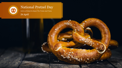 A close up image of soft pretzels with a salt crust, accompanied by a banner announcing National Pretzel Day on April 26th.