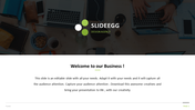 Welcome PPT slide featuring the SlideEgg logo, text, and an overhead view of a desk with laptops and office supplies.