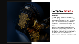 Company awards slide with a close-up of gold bars on a reflective surface and award text details in a dark background.