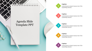 A PowerPoint slide featuring an agenda template with a notepad and pen next to a laptop.