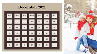 December 2021 calendar with a beige and brown theme next to a mother and daughter wearing red scarves in the snow.