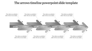 Timeline PowerPoint template with grey gradient arrows from 2016 to 2023 with placeholder text.
