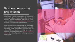 Business PowerPoint slide with a person working on a laptop and documents on a desk with placeholder text.