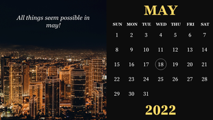 Split calendar design for May 2022 with a city skyline at night on the left and a black background calendar on the right.