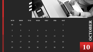 October 2022 calendar with a red and black color scheme, featuring an office workspace with a person using a laptop.