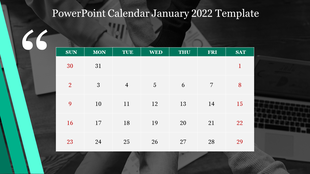 January 2022 calendar template with green headers, red weekend dates, and a grayscale office workspace with hands and laptop.