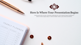 Close up of a yearly planner and pen with a message about the start of your presentation on a white background.