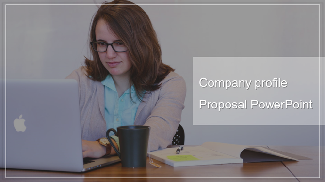 Woman working on a laptop with a coffee cup and notebook, creating a company profile PowerPoint.