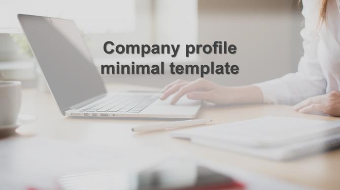 Company profile PowerPoint template features a minimalist design with laptop and desk items.