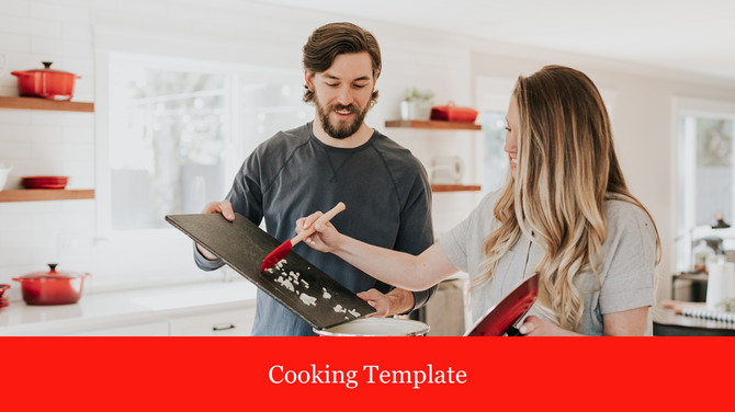 Man and woman cooking together in a bright kitchen, scraping chopped garlic from a board into a pot, with red cookware.