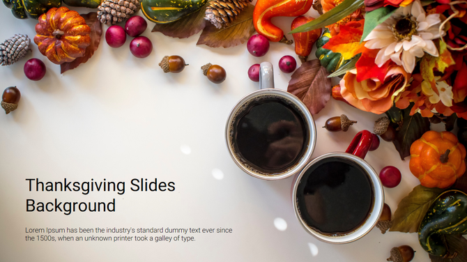 Thanksgiving background with two coffee cups, pumpkins, and colorful autumn decor like acorns and gourd, arranged on surface.
