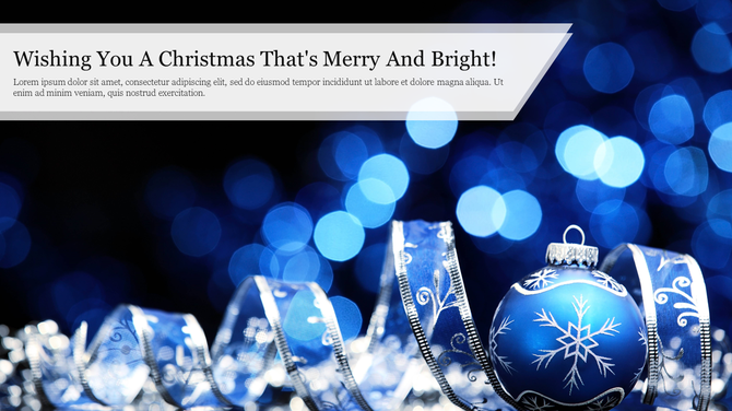 Christmas greeting slide with decorative silver ribbon, blue ornament, and bright circular light bokeh on a dark background.